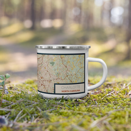 Right View Custom Charlotte North Carolina Map Enamel Mug in Woodblock on Grass With Trees in Background