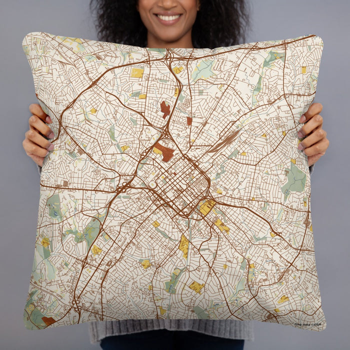 Person holding 22x22 Custom Charlotte North Carolina Map Throw Pillow in Woodblock