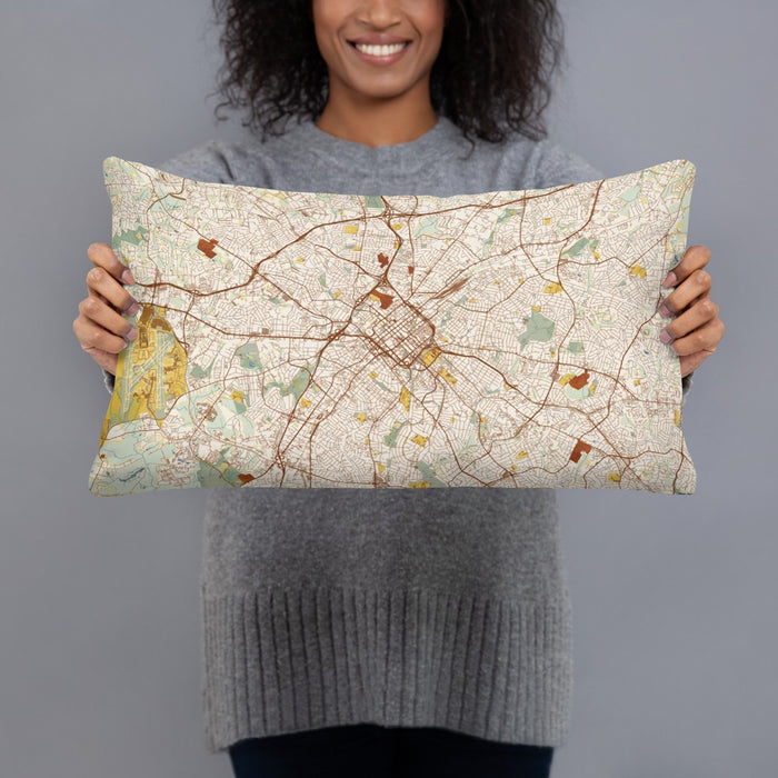 Person holding 20x12 Custom Charlotte North Carolina Map Throw Pillow in Woodblock