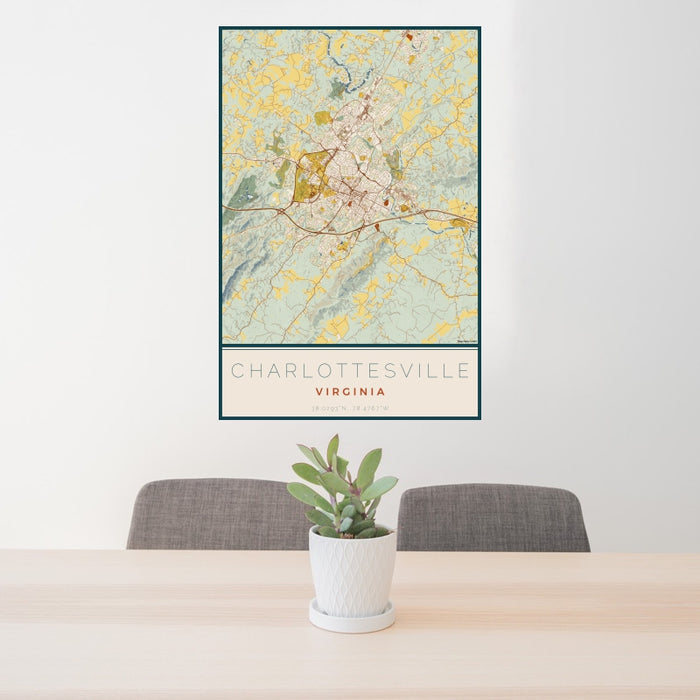 24x36 Charlottesville Virginia Map Print Portrait Orientation in Woodblock Style Behind 2 Chairs Table and Potted Plant