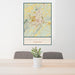 24x36 Charlottesville Virginia Map Print Portrait Orientation in Woodblock Style Behind 2 Chairs Table and Potted Plant