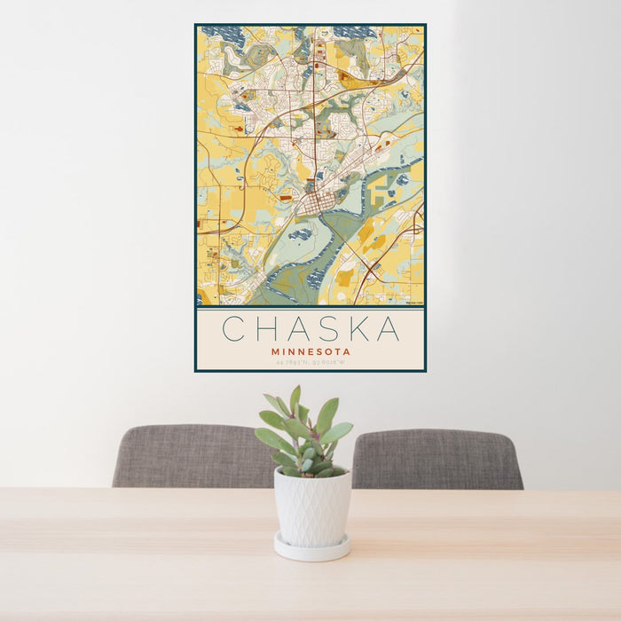 24x36 Chaska Minnesota Map Print Portrait Orientation in Woodblock Style Behind 2 Chairs Table and Potted Plant