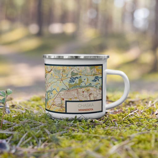 Right View Custom Chaska Minnesota Map Enamel Mug in Woodblock on Grass With Trees in Background