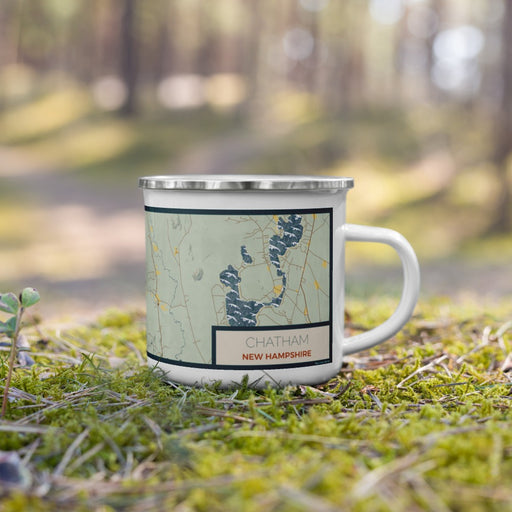 Right View Custom Chatham New Hampshire Map Enamel Mug in Woodblock on Grass With Trees in Background