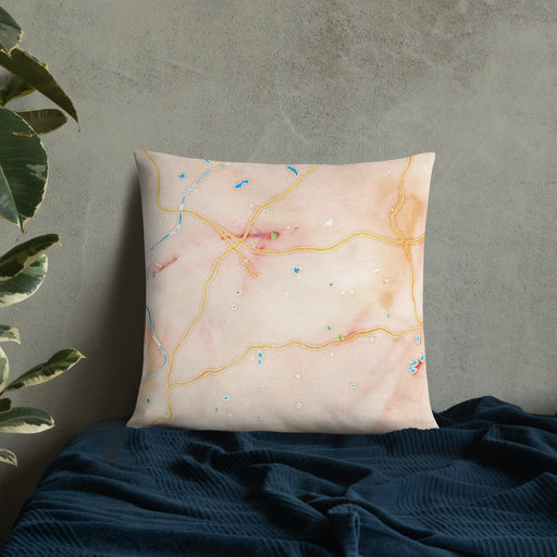 Custom Chattahoochee Hills Georgia Map Throw Pillow in Watercolor on Bedding Against Wall