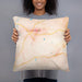 Person holding 18x18 Custom Chattahoochee Hills Georgia Map Throw Pillow in Watercolor