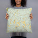 Person holding 18x18 Custom Chattahoochee Hills Georgia Map Throw Pillow in Woodblock