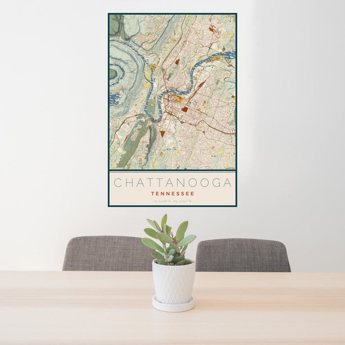 24x36 Chattanooga Tennessee Map Print Portrait Orientation in Woodblock Style Behind 2 Chairs Table and Potted Plant