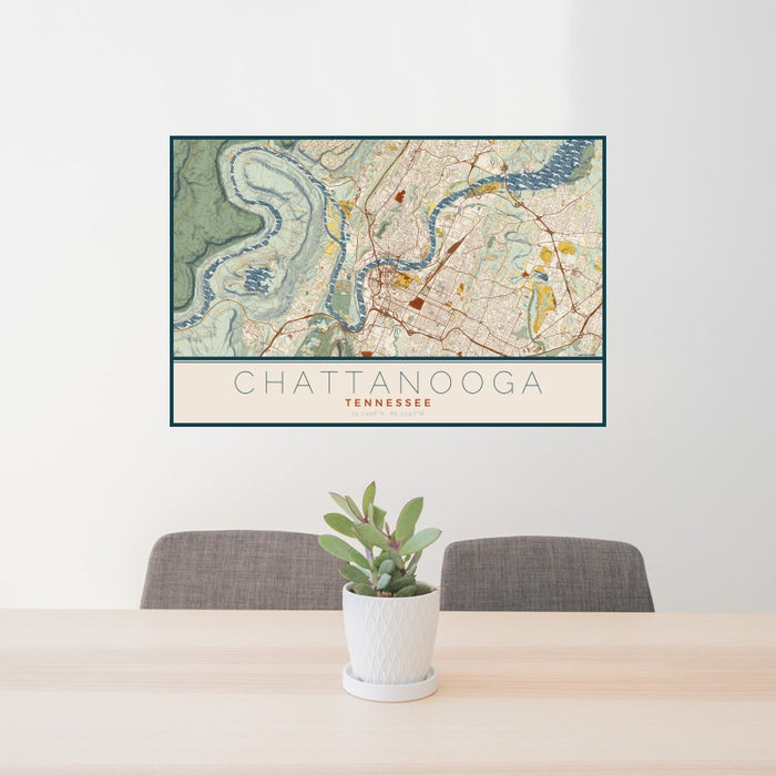 24x36 Chattanooga Tennessee Map Print Landscape Orientation in Woodblock Style Behind 2 Chairs Table and Potted Plant