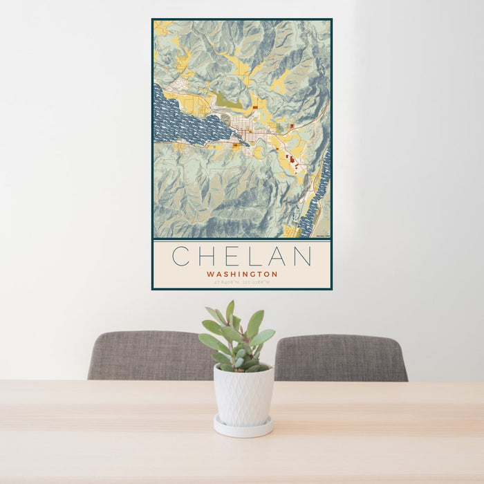 24x36 Chelan Washington Map Print Portrait Orientation in Woodblock Style Behind 2 Chairs Table and Potted Plant