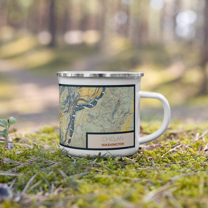 Right View Custom Chelan Washington Map Enamel Mug in Woodblock on Grass With Trees in Background