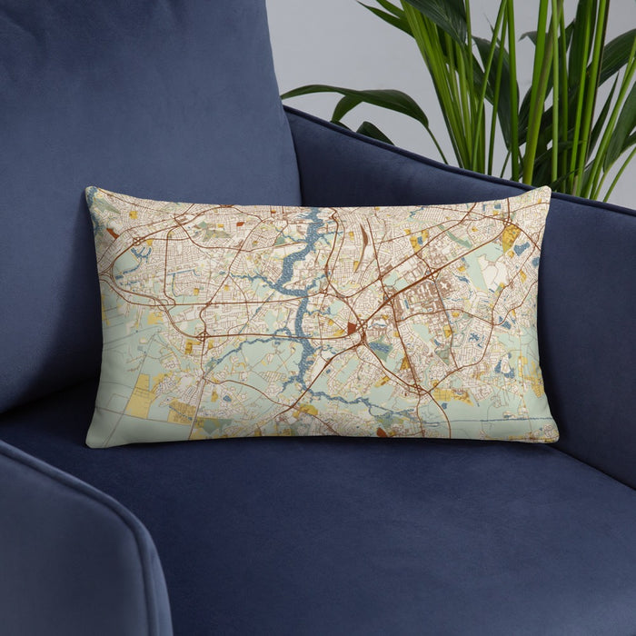 Custom Chesapeake Virginia Map Throw Pillow in Woodblock on Blue Colored Chair