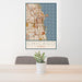 24x36 Chicago Illinois Map Print Portrait Orientation in Woodblock Style Behind 2 Chairs Table and Potted Plant