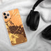Custom Chico California Map Phone Case in Ember on Table with Black Headphones