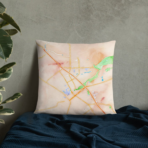Custom Chico California Map Throw Pillow in Watercolor on Bedding Against Wall