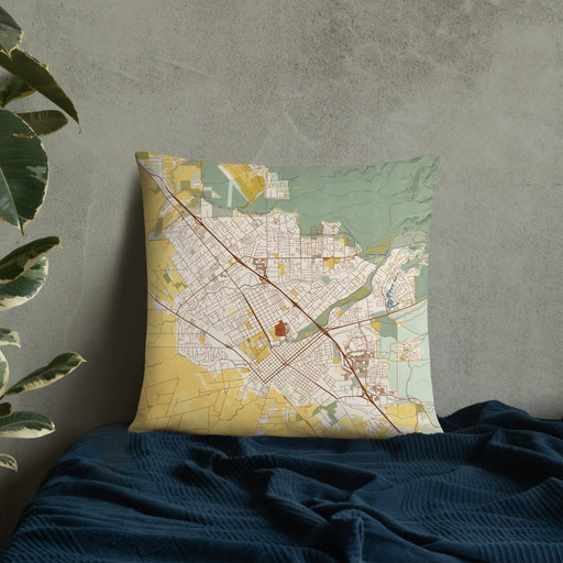 Custom Chico California Map Throw Pillow in Woodblock on Bedding Against Wall