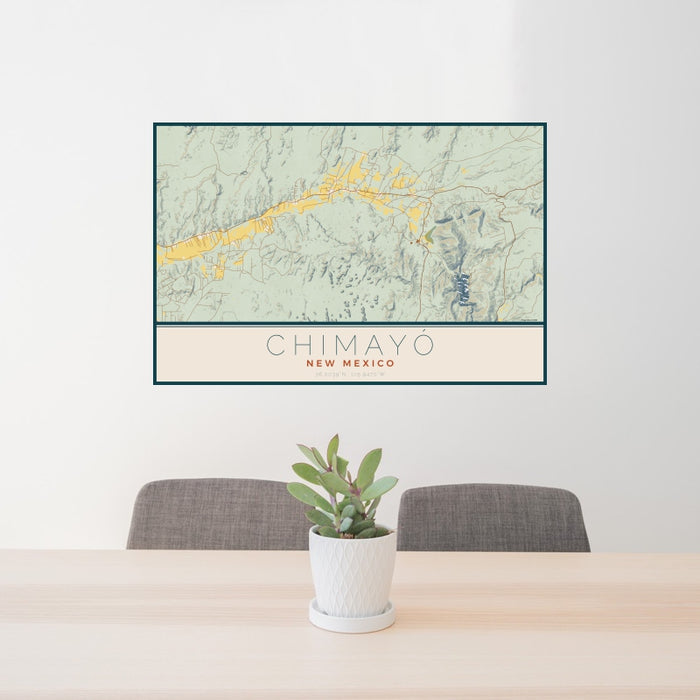24x36 Chimayó New Mexico Map Print Landscape Orientation in Woodblock Style Behind 2 Chairs Table and Potted Plant