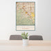 24x36 Chino Hills California Map Print Portrait Orientation in Woodblock Style Behind 2 Chairs Table and Potted Plant