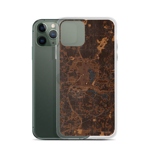 Custom Chisholm Minnesota Map Phone Case in Ember on Table with Laptop and Plant