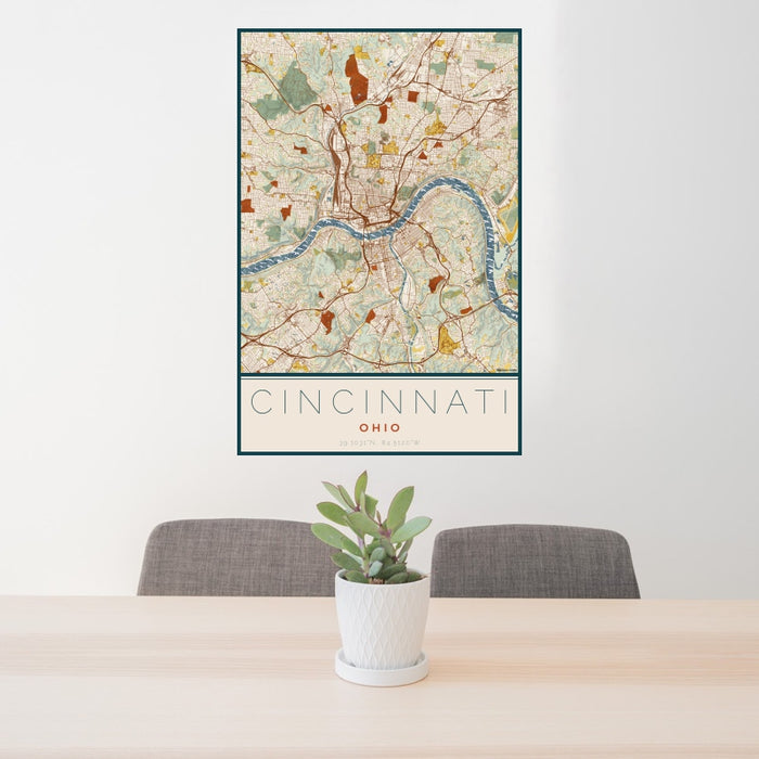 24x36 Cincinnati Ohio Map Print Portrait Orientation in Woodblock Style Behind 2 Chairs Table and Potted Plant