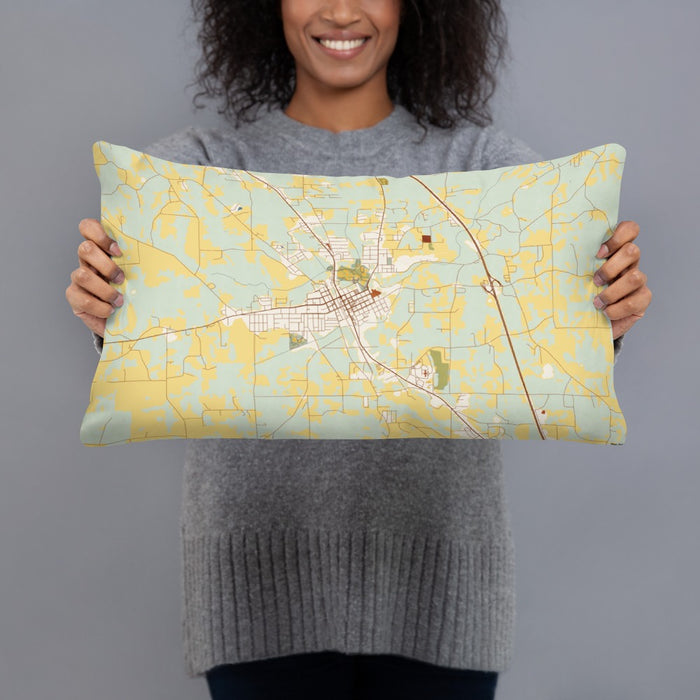 Person holding 20x12 Custom Clanton Alabama Map Throw Pillow in Woodblock