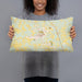 Person holding 20x12 Custom Clanton Alabama Map Throw Pillow in Woodblock