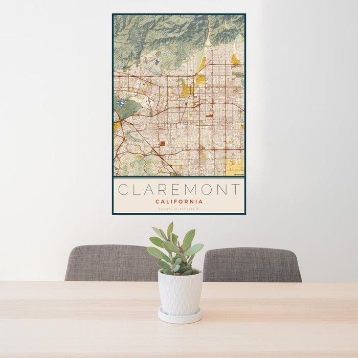 24x36 Claremont California Map Print Portrait Orientation in Woodblock Style Behind 2 Chairs Table and Potted Plant
