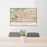 24x36 Claremont California Map Print Landscape Orientation in Woodblock Style Behind 2 Chairs Table and Potted Plant