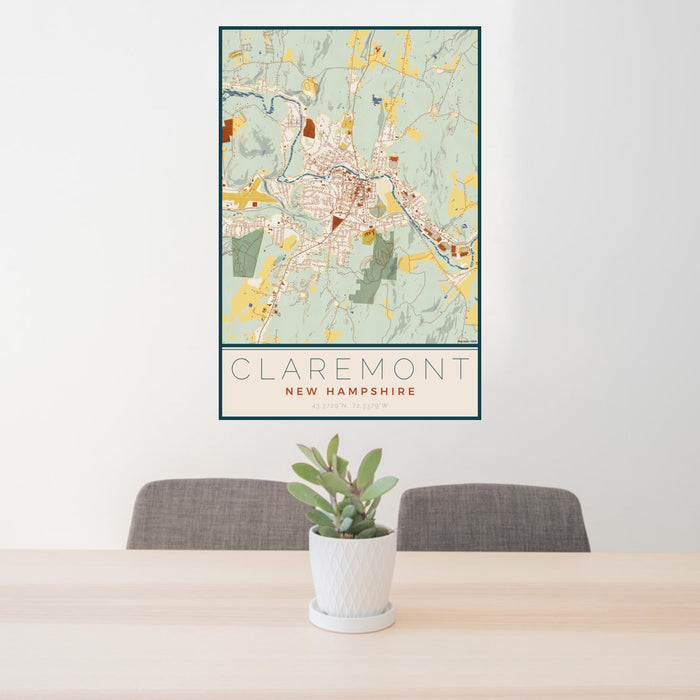 24x36 Claremont New Hampshire Map Print Portrait Orientation in Woodblock Style Behind 2 Chairs Table and Potted Plant