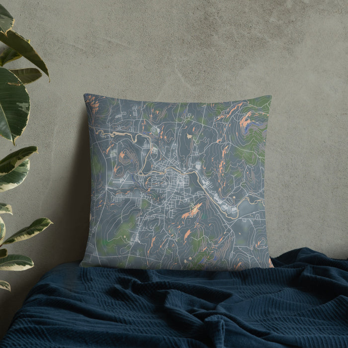 Custom Claremont New Hampshire Map Throw Pillow in Afternoon on Bedding Against Wall
