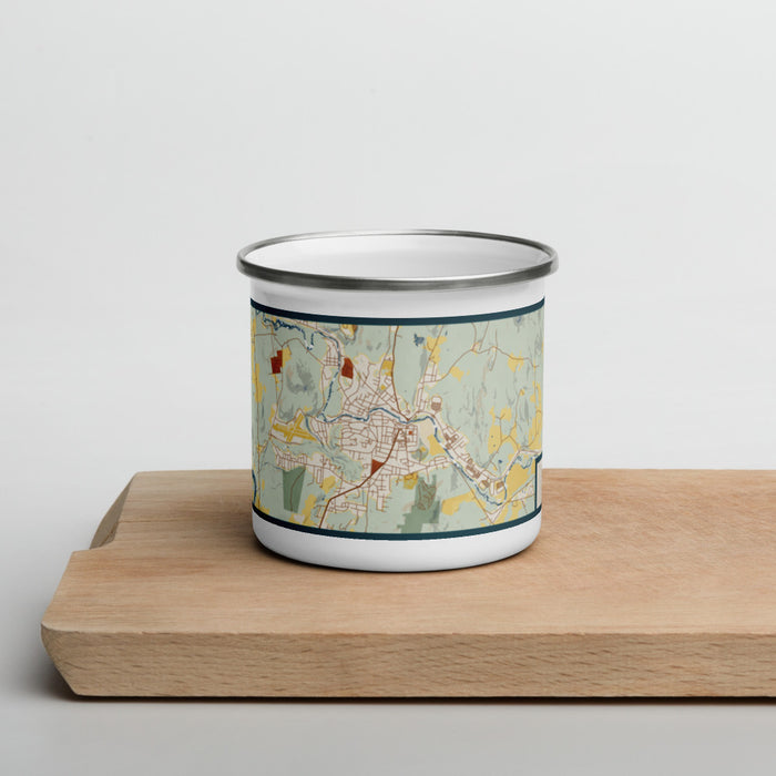 Front View Custom Claremont New Hampshire Map Enamel Mug in Woodblock on Cutting Board