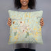 Person holding 18x18 Custom Claremont New Hampshire Map Throw Pillow in Woodblock