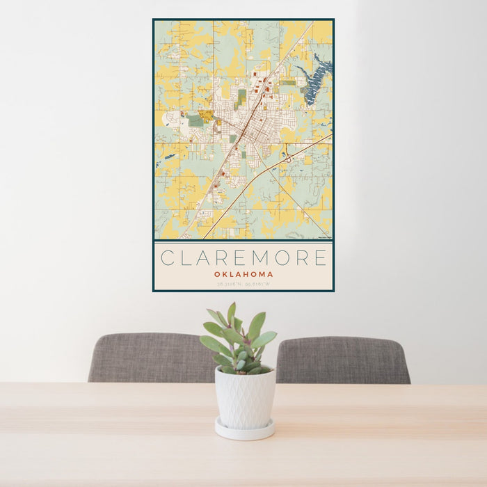 24x36 Claremore Oklahoma Map Print Portrait Orientation in Woodblock Style Behind 2 Chairs Table and Potted Plant