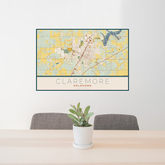 24x36 Claremore Oklahoma Map Print Landscape Orientation in Woodblock Style Behind 2 Chairs Table and Potted Plant
