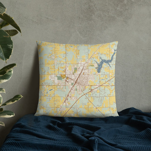 Custom Claremore Oklahoma Map Throw Pillow in Woodblock on Bedding Against Wall