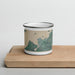 Front View Custom Clayton New York Map Enamel Mug in Afternoon on Cutting Board