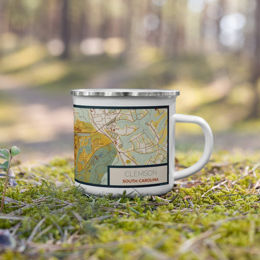 Right View Custom Clemson South Carolina Map Enamel Mug in Woodblock on Grass With Trees in Background