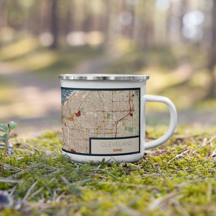 Right View Custom Cleveland Ohio Map Enamel Mug in Woodblock on Grass With Trees in Background