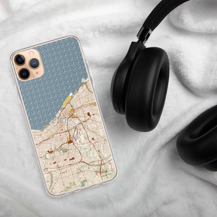 Custom Cleveland Ohio Map Phone Case in Woodblock on Table with Black Headphones