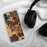 Custom Clifton Virginia Map Phone Case in Ember on Table with Black Headphones