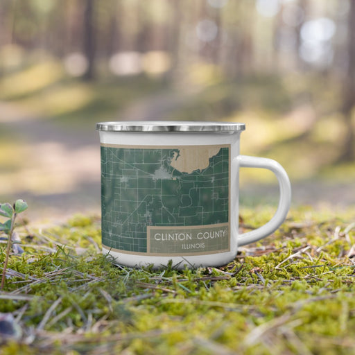 Right View Custom Clinton County Illinois Map Enamel Mug in Afternoon on Grass With Trees in Background