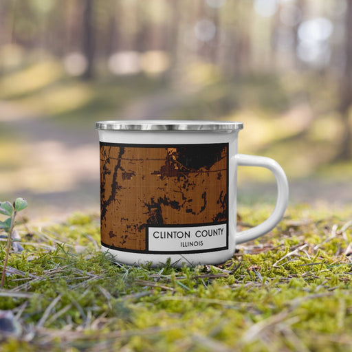Right View Custom Clinton County Illinois Map Enamel Mug in Ember on Grass With Trees in Background