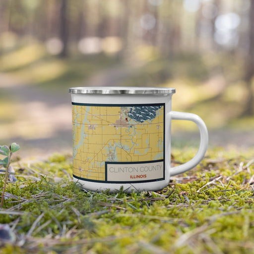 Right View Custom Clinton County Illinois Map Enamel Mug in Woodblock on Grass With Trees in Background