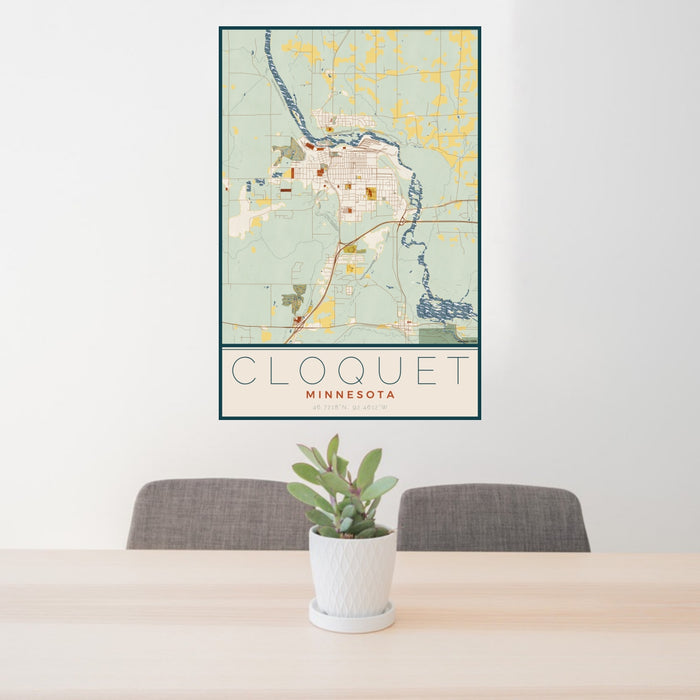 24x36 Cloquet Minnesota Map Print Portrait Orientation in Woodblock Style Behind 2 Chairs Table and Potted Plant