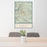 24x36 Cloudcroft New Mexico Map Print Portrait Orientation in Woodblock Style Behind 2 Chairs Table and Potted Plant