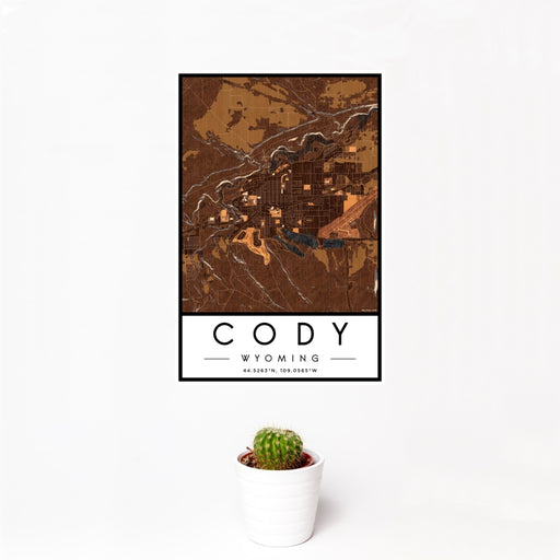 12x18 Cody Wyoming Map Print Portrait Orientation in Ember Style With Small Cactus Plant in White Planter