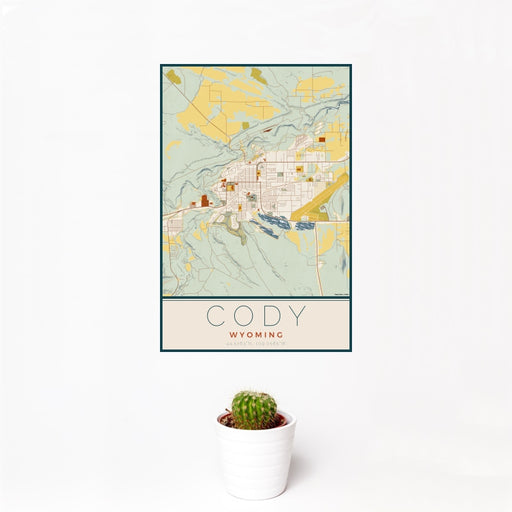 12x18 Cody Wyoming Map Print Portrait Orientation in Woodblock Style With Small Cactus Plant in White Planter