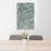24x36 Cody Wyoming Map Print Portrait Orientation in Afternoon Style Behind 2 Chairs Table and Potted Plant