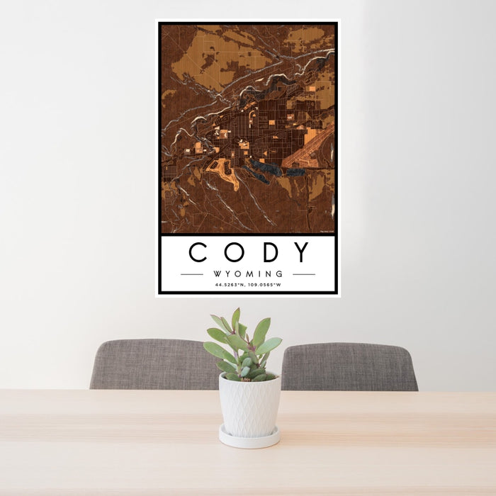 24x36 Cody Wyoming Map Print Portrait Orientation in Ember Style Behind 2 Chairs Table and Potted Plant