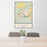 24x36 Cody Wyoming Map Print Portrait Orientation in Woodblock Style Behind 2 Chairs Table and Potted Plant